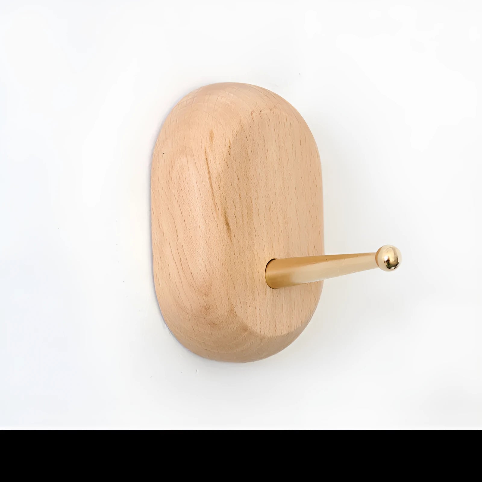 Solid beech wood adhesive wall hook with brass fitting in five shapes: capsule, diamond, oval, round, square.