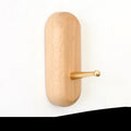Solid beech wood adhesive wall hook with brass fitting in five shapes: capsule, diamond, oval, round, square.