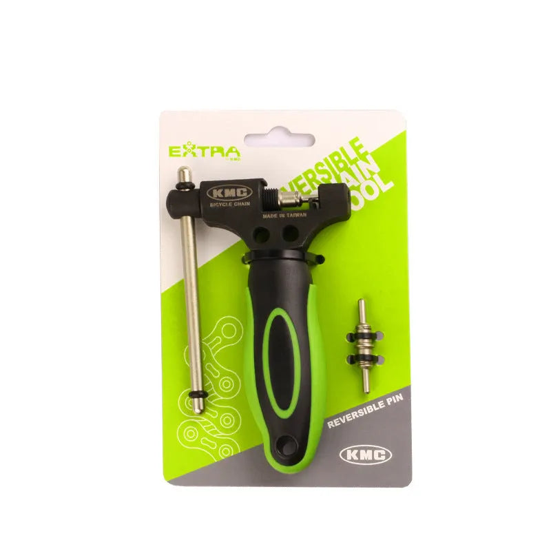 Green steel bicycle chain cutter tool with double shaft chaining device on a workbench
