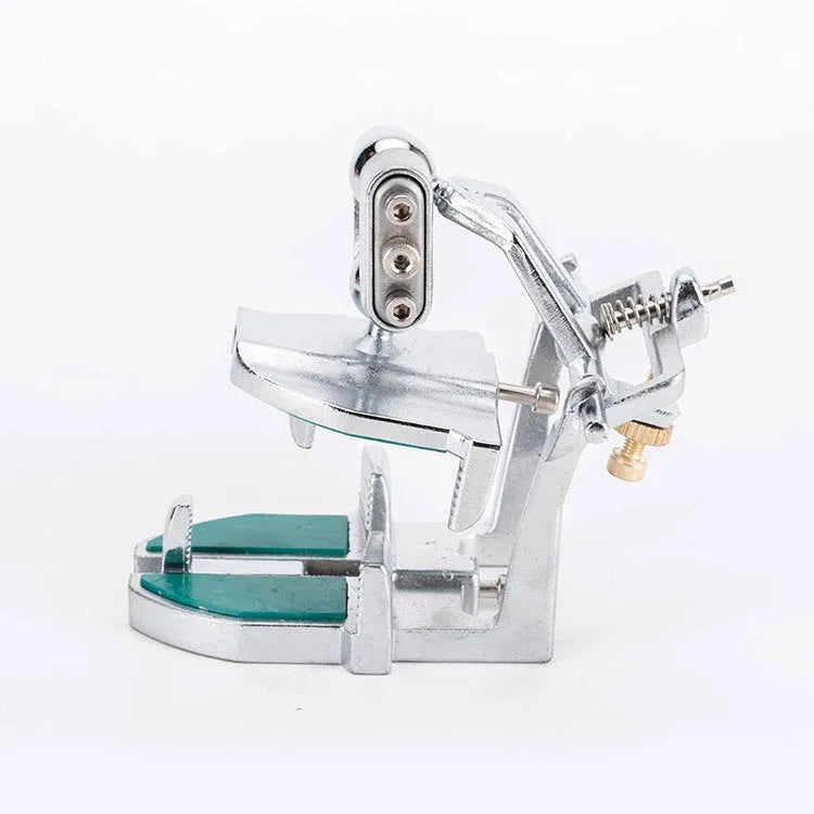 Korean dental articulator showing three adjustable settings and plastic construction