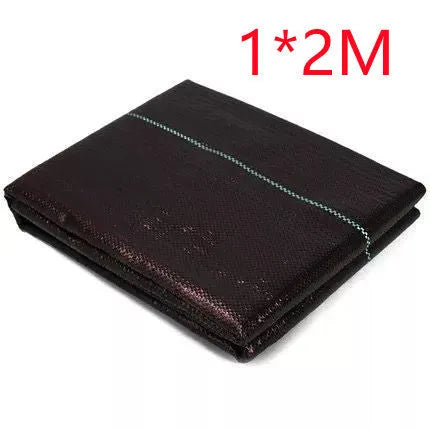 Black plastic woven weed-proof cloth laid flat on soil.