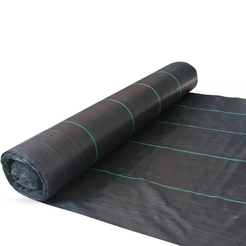 Black plastic woven weed-proof cloth laid flat on soil.