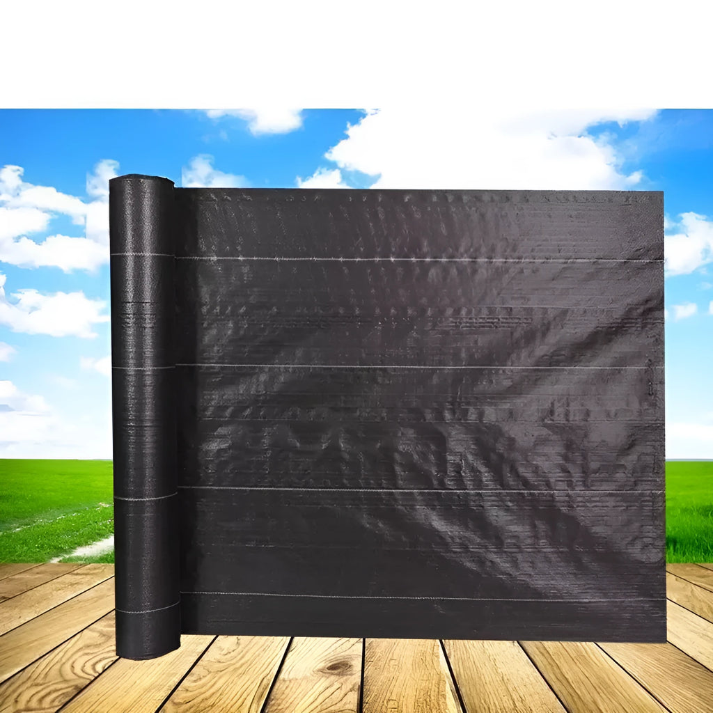 Black plastic woven weed-proof cloth laid flat on soil.