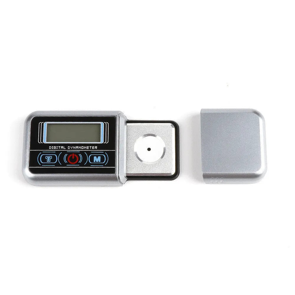A compact digital electronic scale with a 100g capacity and 0.005g precision, shown weighing small items.