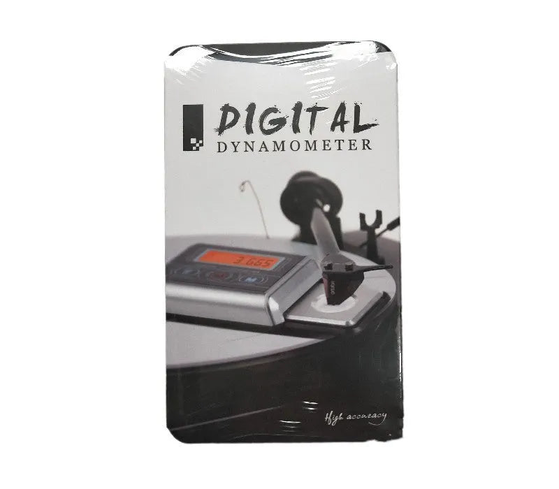 A compact digital electronic scale with a 100g capacity and 0.005g precision, shown weighing small items.