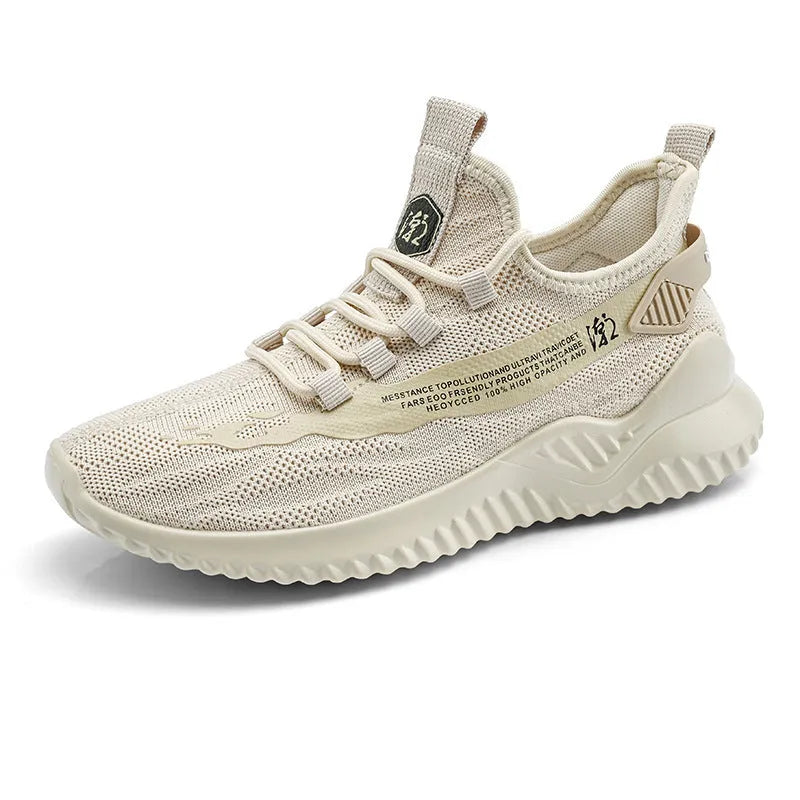 Men's low-top white mesh sports shoes with rubber sole and front-tie laces on a plain background.