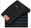 Men's slim straight leg cotton stretch jeans in dark blue with whisker and fraying details