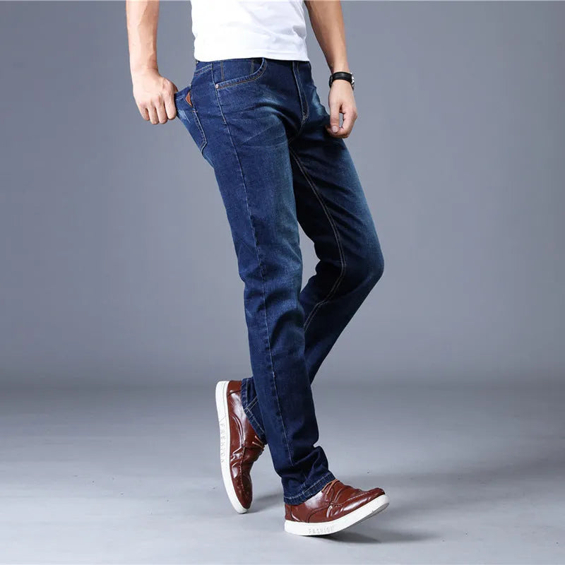 Men's slim straight leg cotton stretch jeans in dark blue with whisker and fraying details