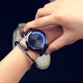 Electronic digital wristwatch with blue LED light display in black or white colour