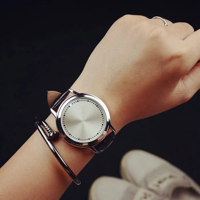Electronic digital wristwatch with blue LED light display in black or white colour