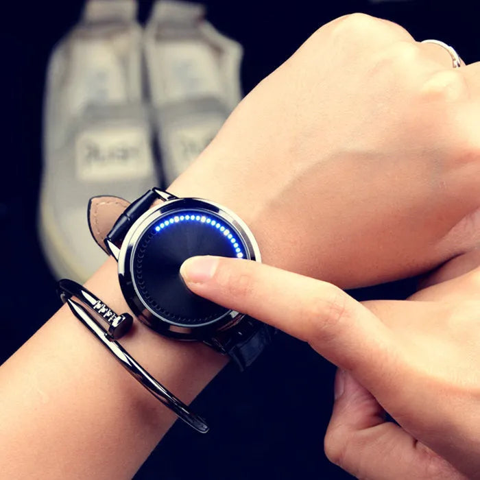 Electronic digital wristwatch with blue LED light display in black or white colour