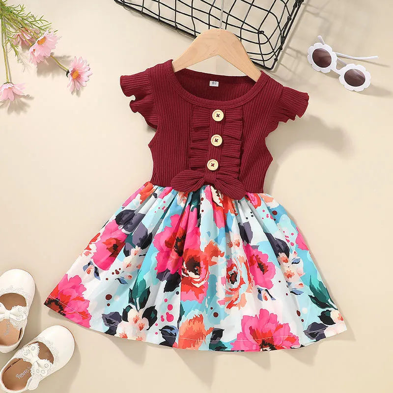 Sleeveless summer dress for toddler girl on hanger.
