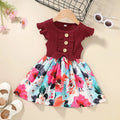 Sleeveless summer dress for toddler girl on hanger.