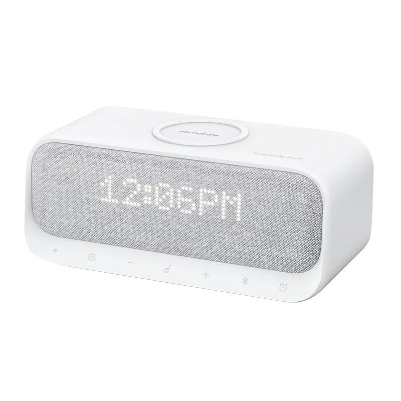 Anker Soundcore white Bluetooth speaker with wireless charging pad and digital alarm clock display