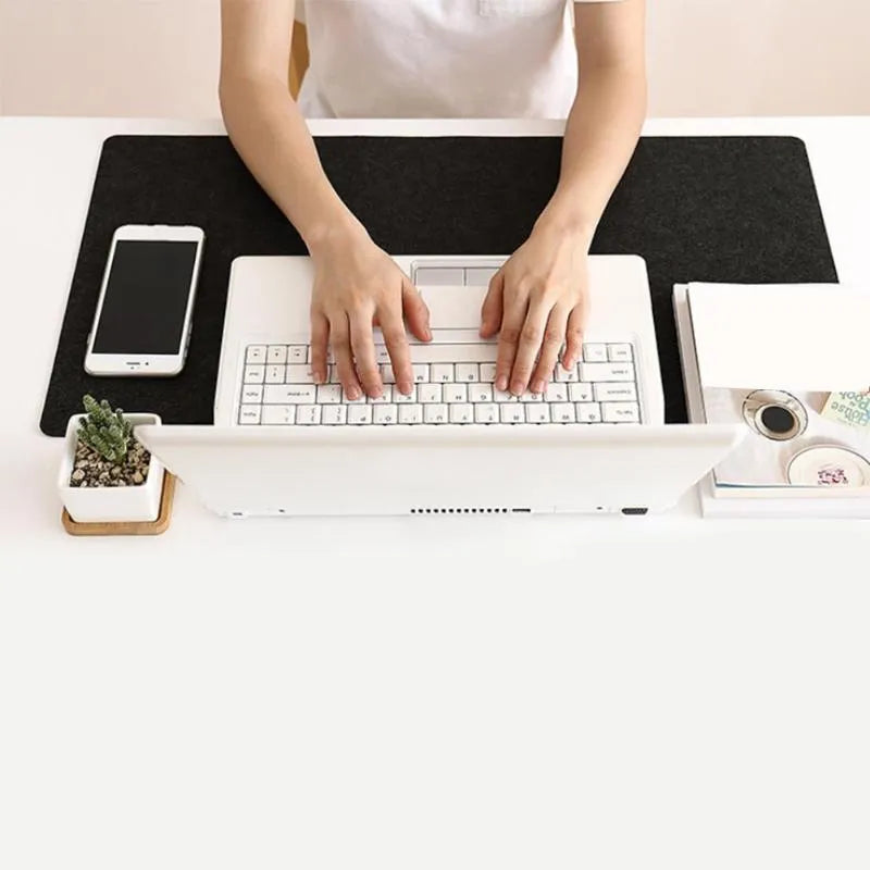 Felt gaming keyboard pad in 30x60cm size, single-sided, black colour, on desk with keyboard and mouse