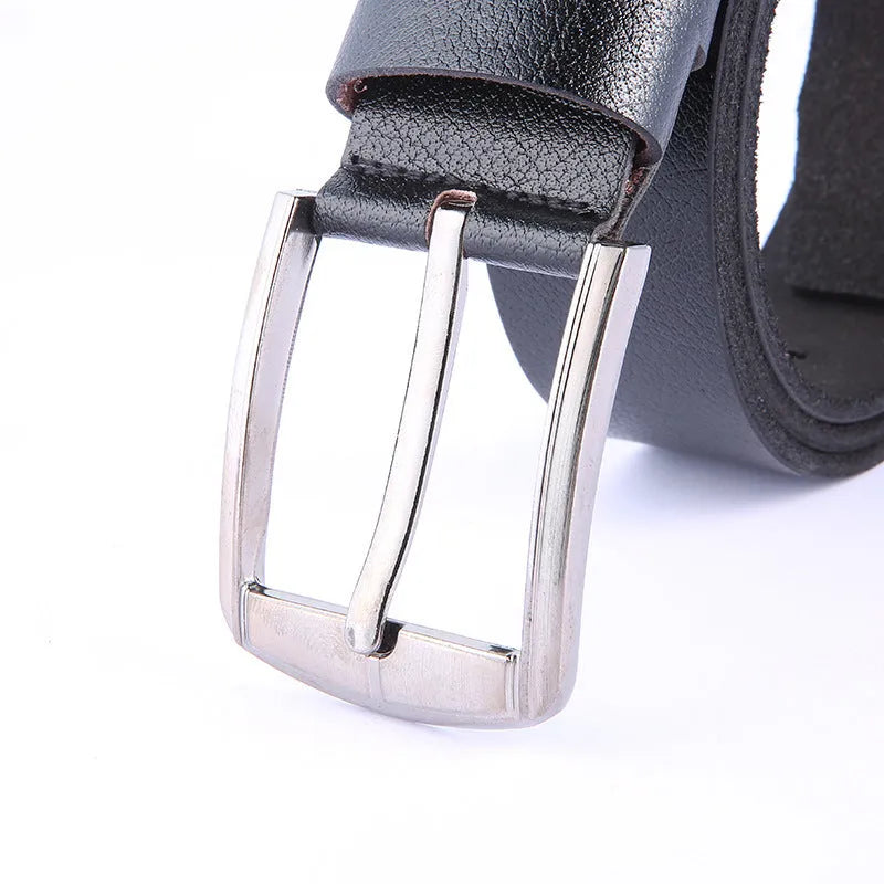 Leather pin buckle belt in black and camel colours on a plain background