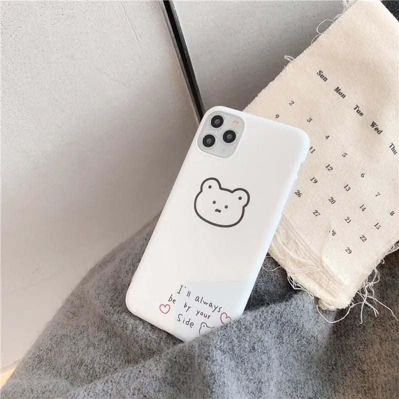 Soft silicone mobile phone case with Korean bear cartoon design for Samsung Z Flip 6 and iPhones.