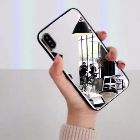 Black iPhone case with a square glass mirror on the back, compatible with iPhone 7 Plus, 8 Plus, and X models.