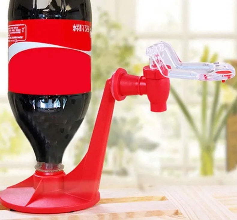 Red plastic Magic Tap soda dispenser screwed onto a 2-litre bottle with push-in tap