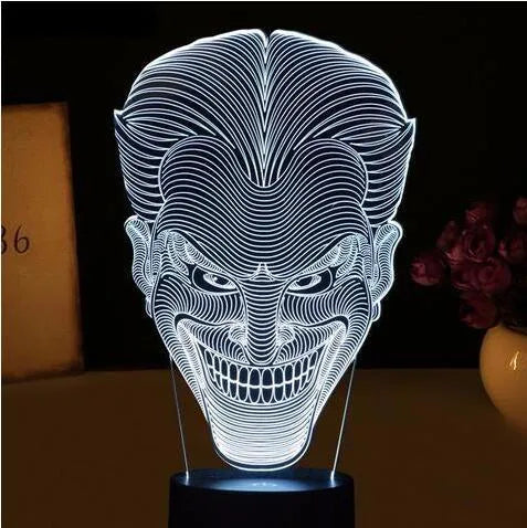 USB-powered acrylic 3D LED table lamp displaying blue light on a desk