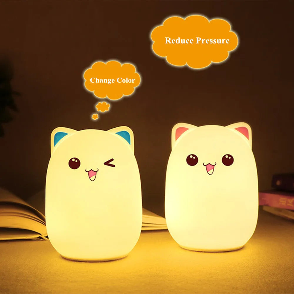 Cartoon silicone clapping lamp in Princess Bear style showing warm white light on a wooden table
