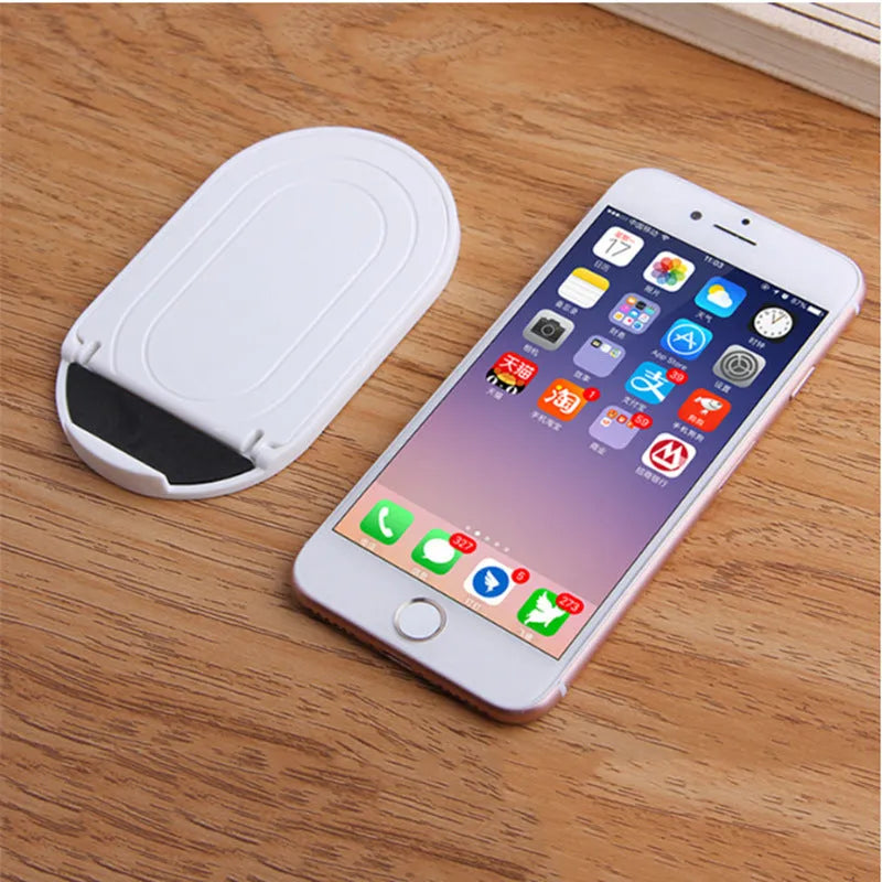 Plastic lazy bracket mobile phone stand in one of six colour options: black, blue, grey, pink, white, or yellow.