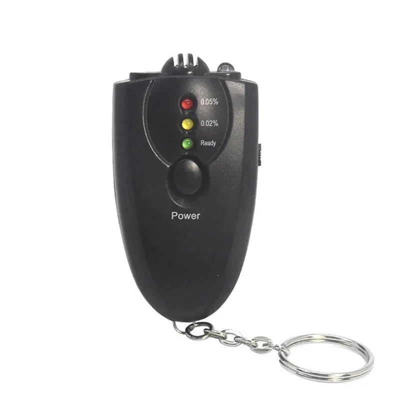Black portable breath alcohol tester with LED display, torch flashlight, and keychain attachment on a white background