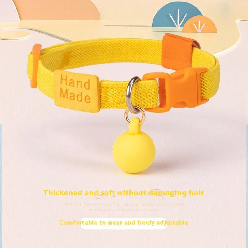 Small dog polyester pet collar in various solid colours showing high elastic adjustable band.