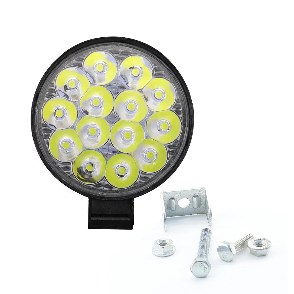 Mini round aluminium car LED work light with white light, shown for off-road vehicle installation.