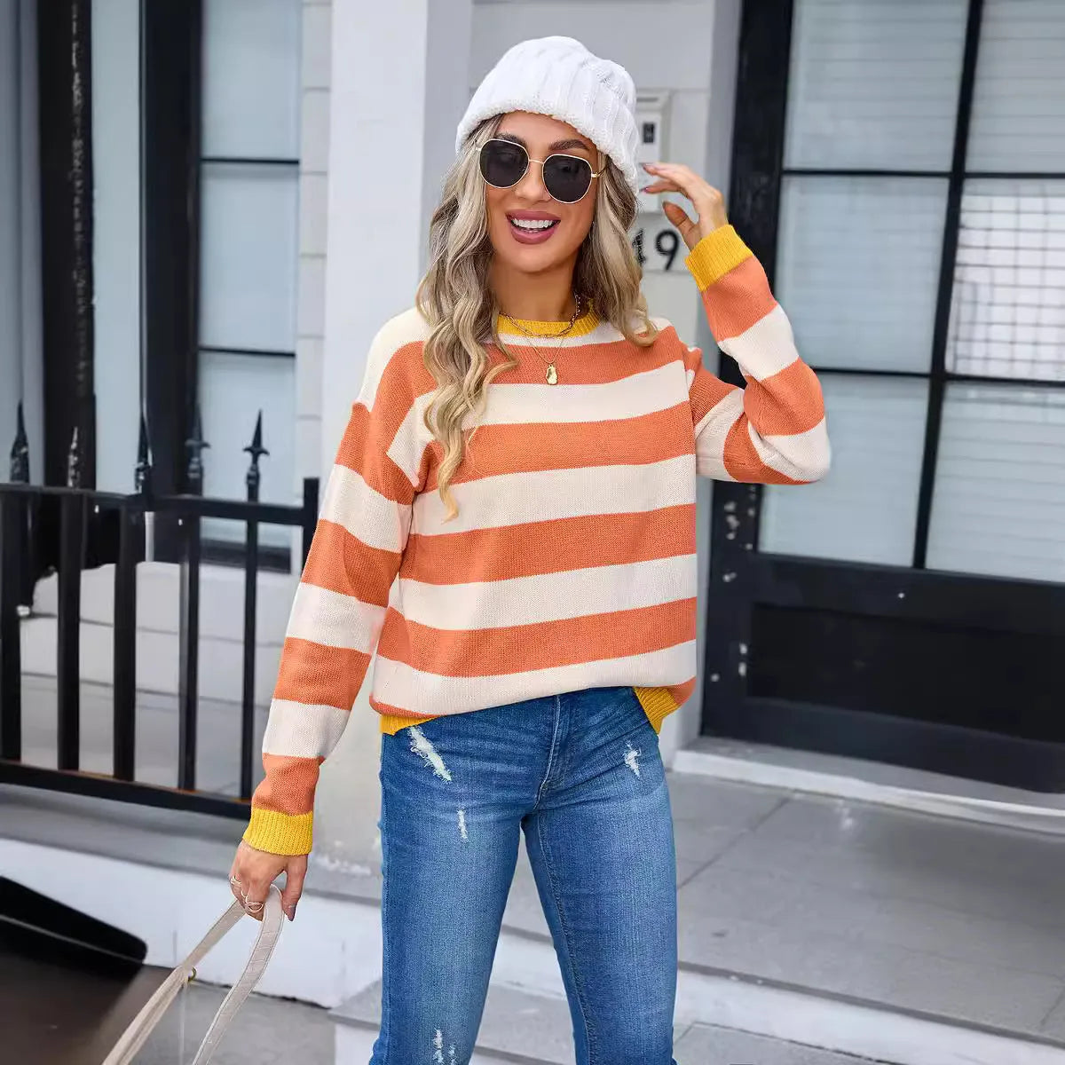 Women's loose fit acrylic sweater with long sleeves in striped or plaid pattern, colours: khaki, yellow, orange, pink, blue.