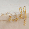 Six gold-colour chain tassel earrings with zircon detail arranged as a complete set