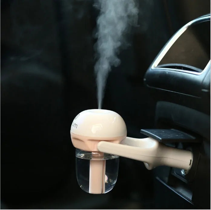 Portable car humidifier with rotating nozzle in blue, green, pink, or purple colours
