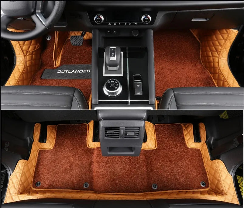 Custom black floor mats fitted in a 2023 Mitsubishi Outlander footwell
