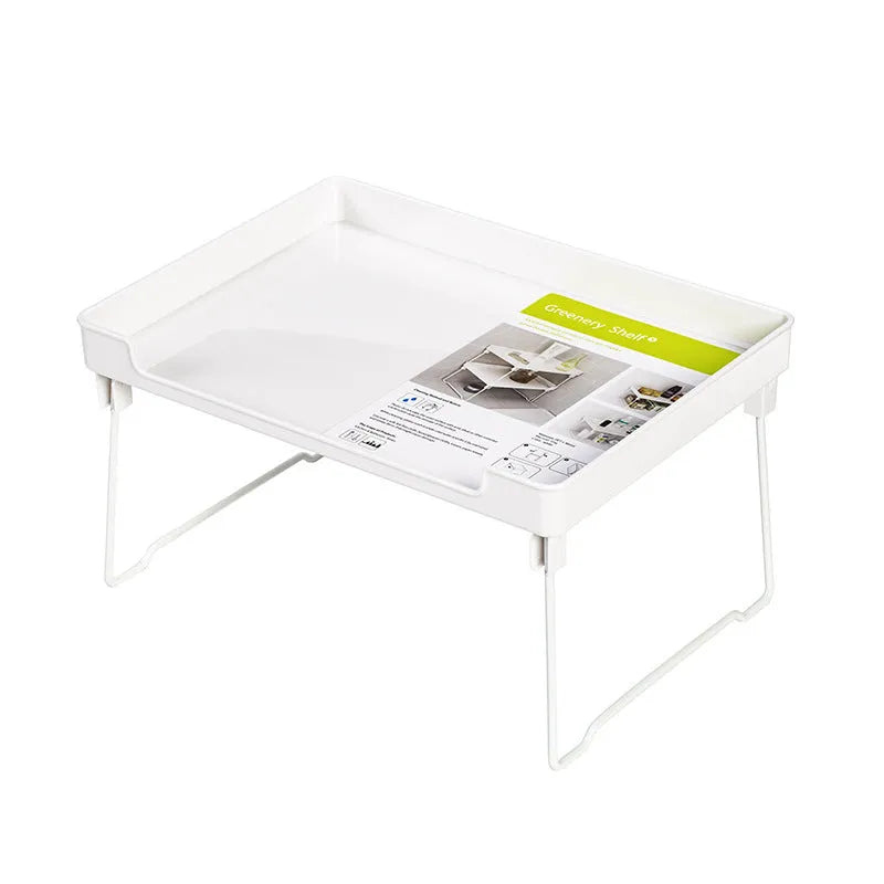A transparent plastic kitchen storage rack holding utensils and spice jars on a countertop.