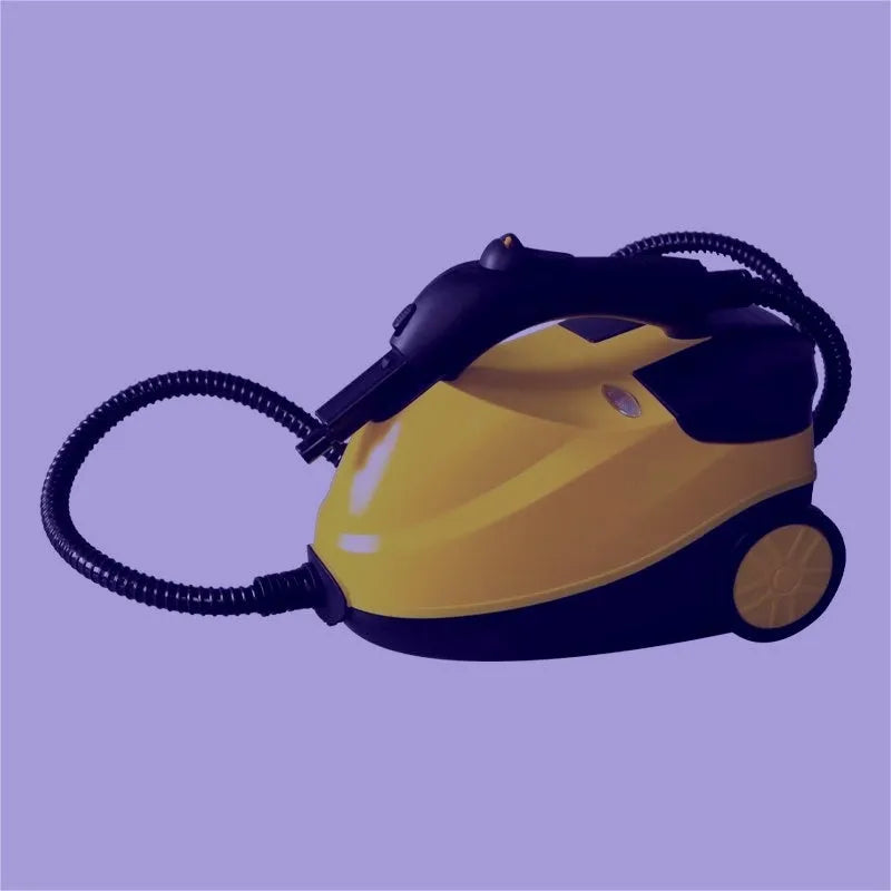 Yellow handheld steam cleaning machine with copper and plastic body on plain background