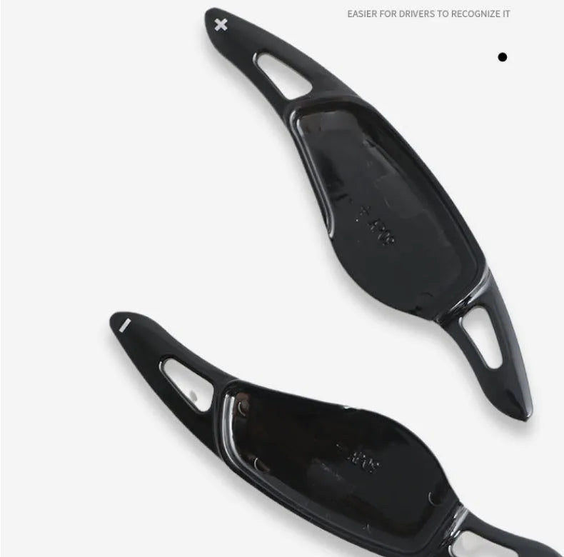 Carbon fibre pattern steering wheel paddle shift modification kit for car interior.