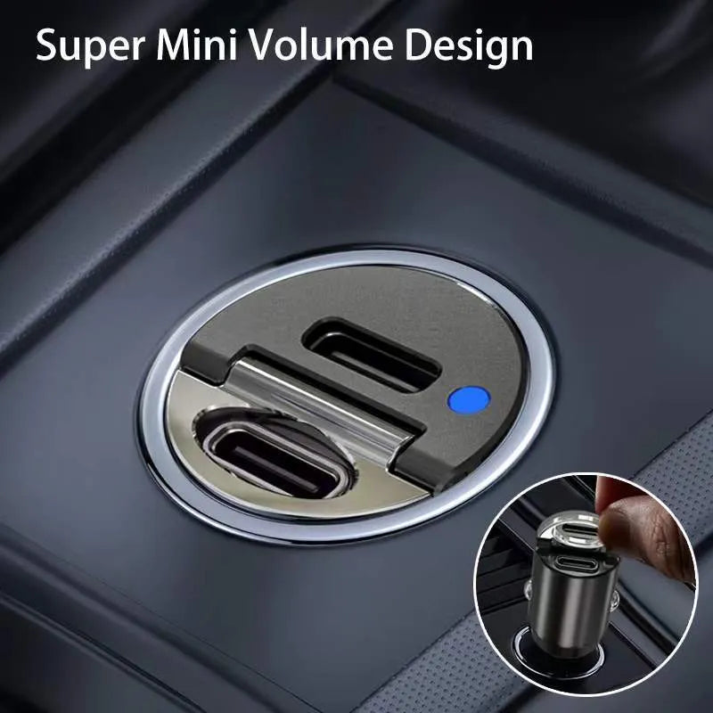 Black mini 30W dual USB car charger with zinc alloy housing next to a car cigarette lighter socket.