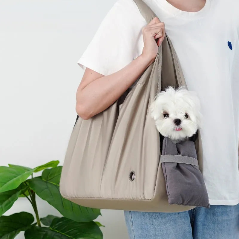 Apricot-coloured cloth pet carrier handbag for outdoor use with small pets.