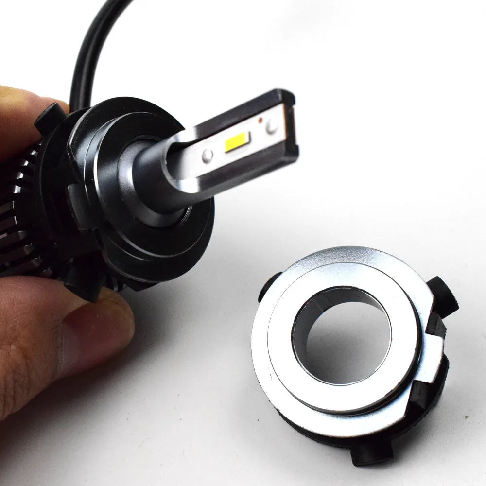 White ABS plastic car LED headlight bulb holder on a grey background.