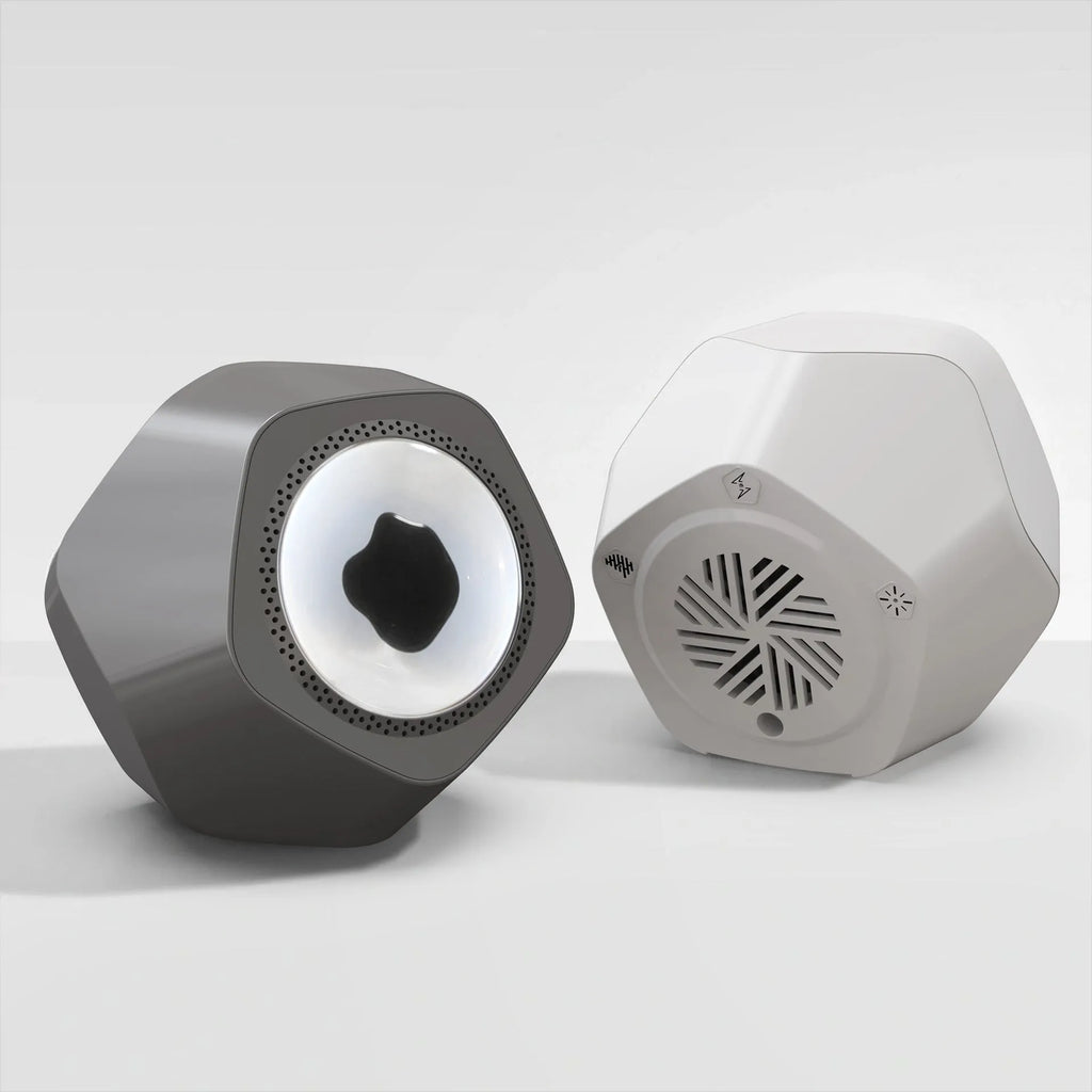 Floating magnetic fluid Bluetooth speaker in black showing fluid spikes, on a desk, with compact 137mm dimensions