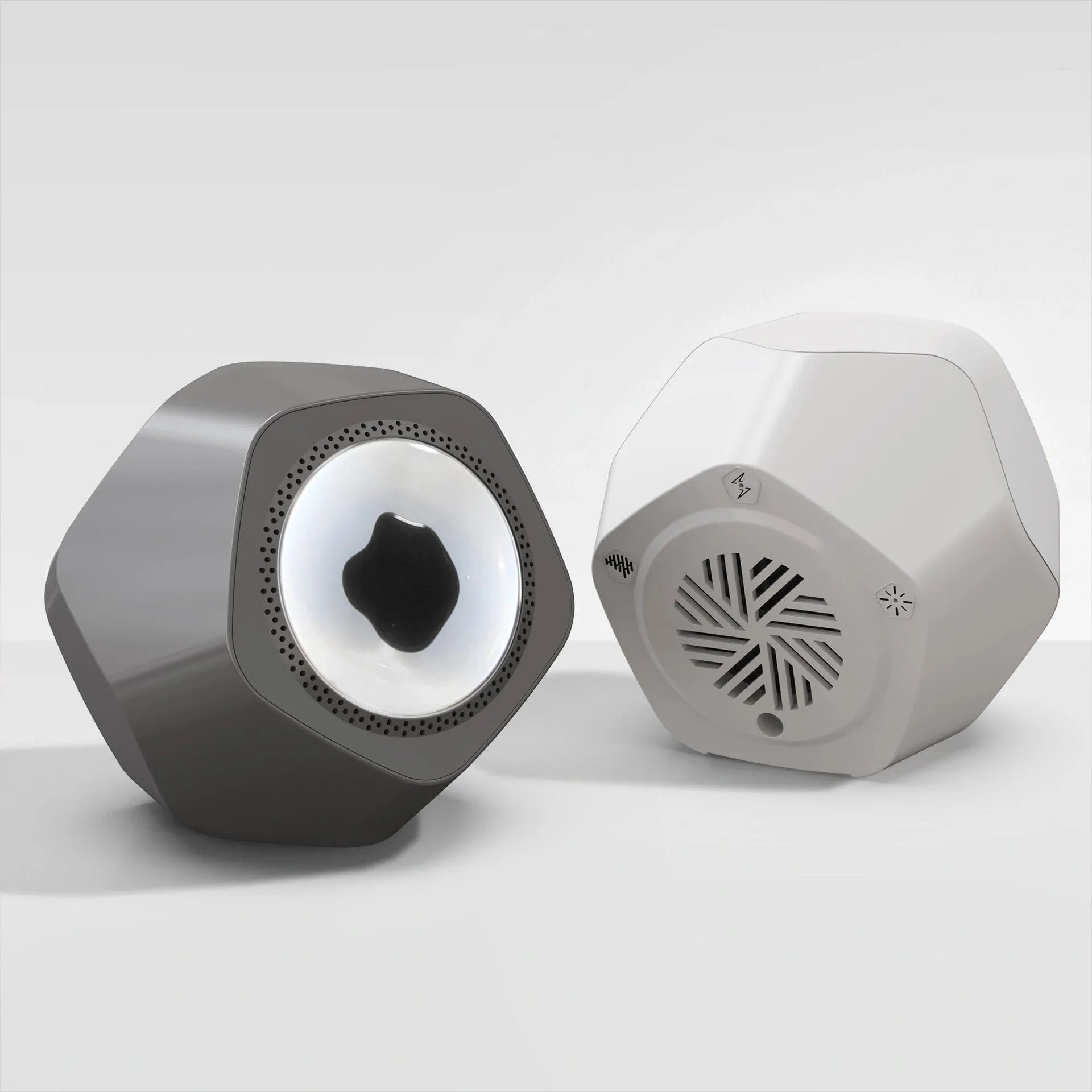 Floating magnetic fluid Bluetooth speaker in black showing fluid spikes, on a desk, with compact 137mm dimensions