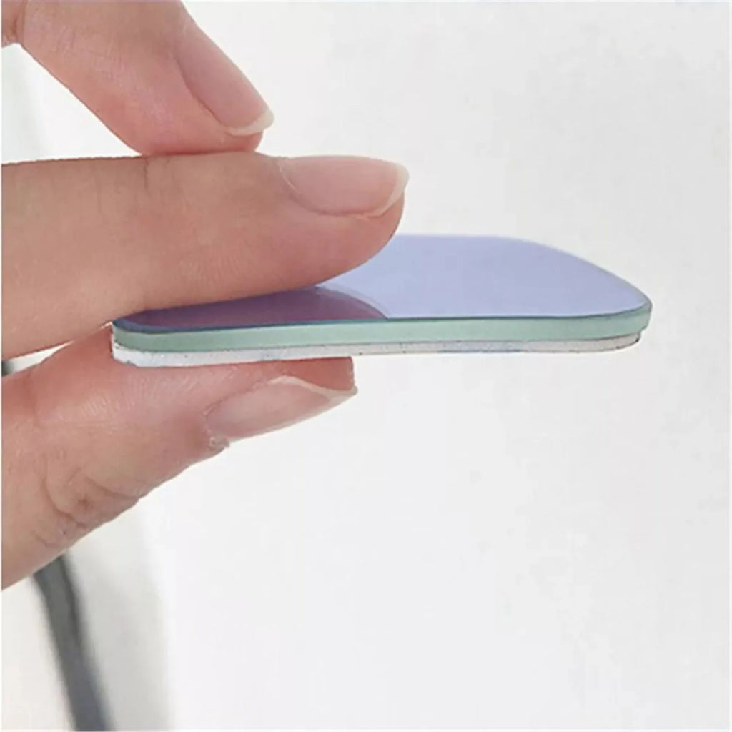 Pair of white, fan-shaped, circular glass blind spot mirrors for cars, shown adjustable.