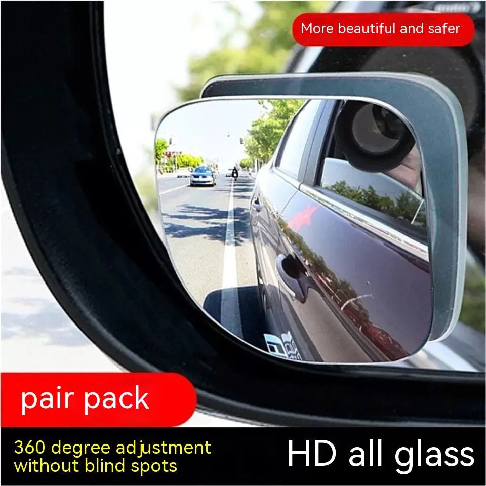 Pair of white, fan-shaped, circular glass blind spot mirrors for cars, shown adjustable.