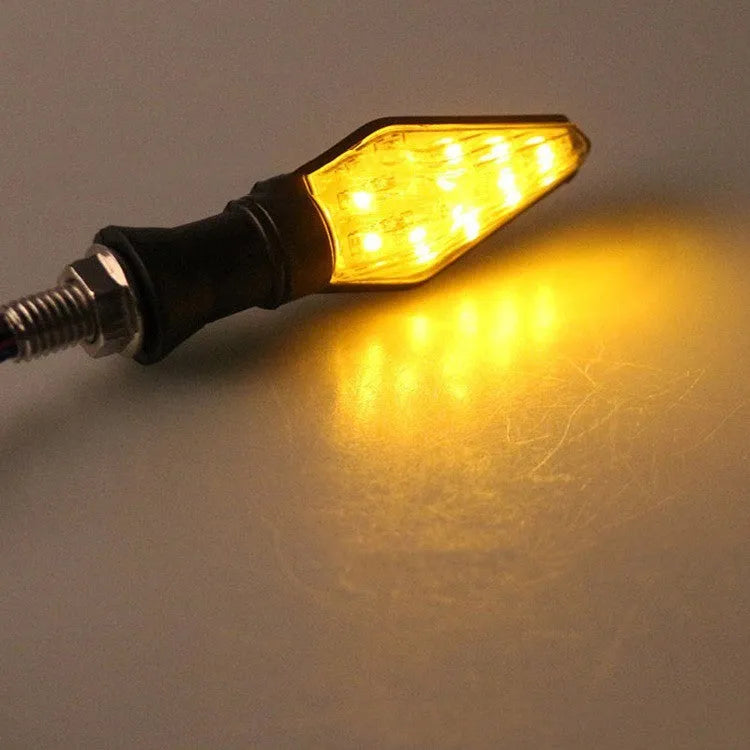 Double-sided luminous LED turn signal for motorcycle with yellow and blue light options, plastic housing, 12V