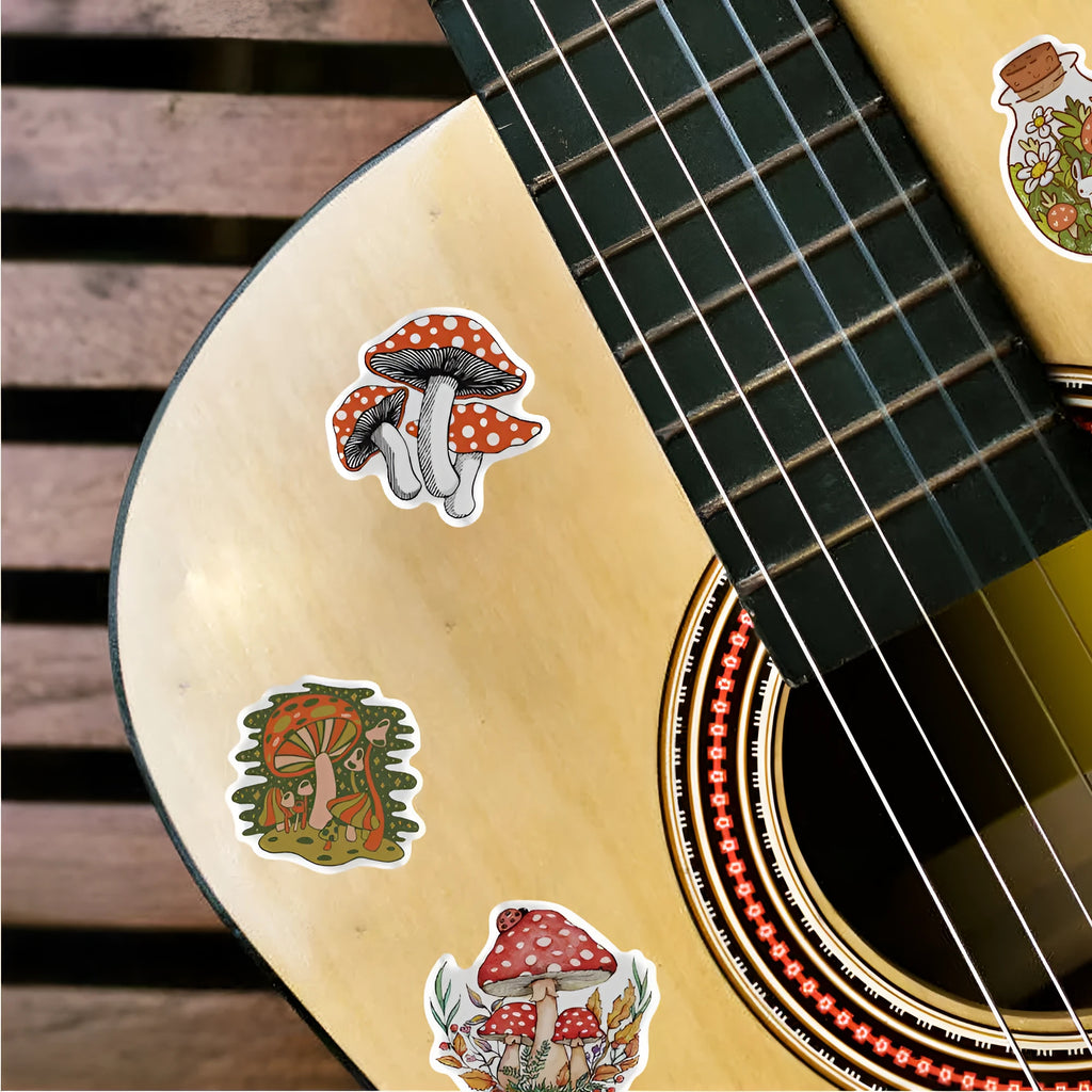 50 cartoon PVC waterproof stickers in assorted graffiti styles including astronaut, drink, and animal designs on a white background