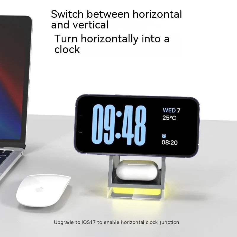 Black three-in-one magnetic wireless charger with night lamp charging phone, watch, and headset on a desk