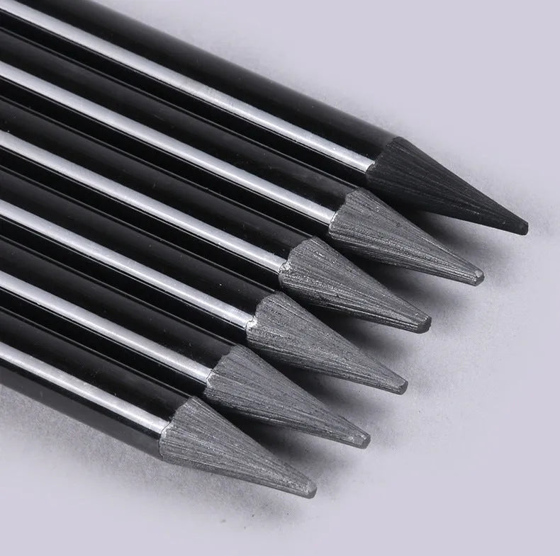 Set of six graphite pencils and three carbonized drawing pencils with wooden casings on a blister card.