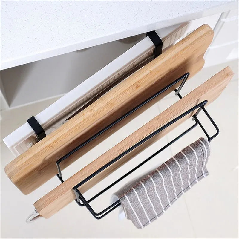 Double-layer iron kitchen storage rack holding towels and chopping board, black finish, wall mounted