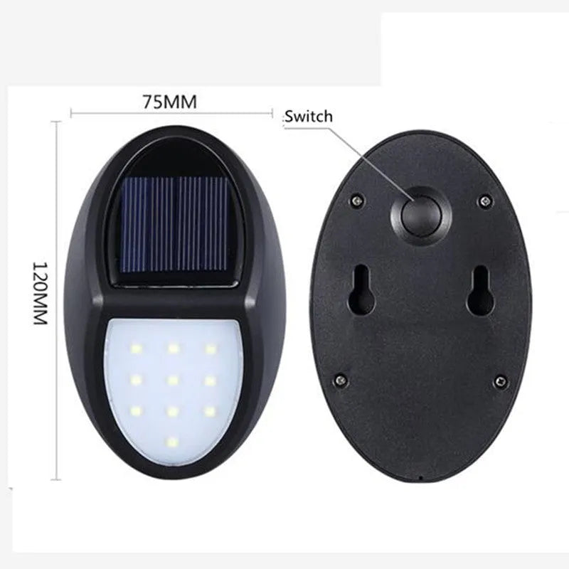 Black rectangular LED solar wall light mounted on an exterior wall for automatic night-time illumination.