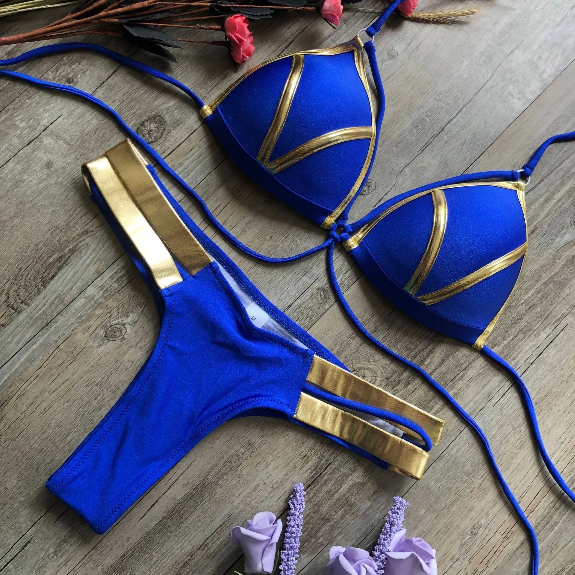 Women's bronzing bikini swimwear with padded cups, shown in a colour option like leopard print.